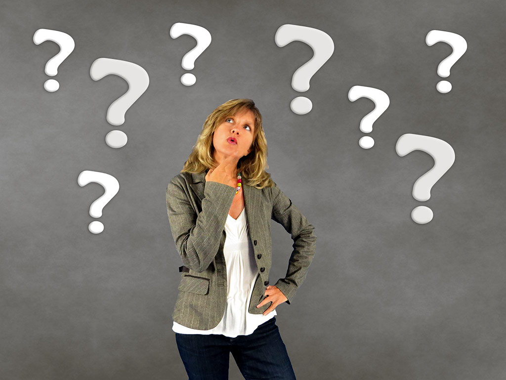 woman with questioning expression and question marks how much social media is right for you